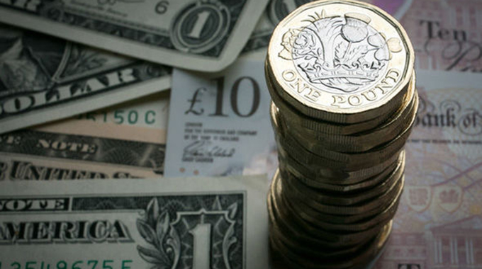 Zimbabwe government outlaws multi currency system , reintroduces Zim dollar