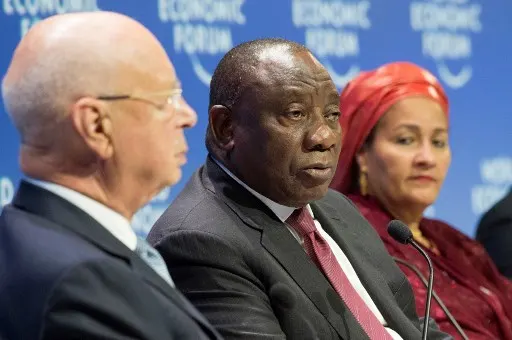 Klaus Schwab (L), founder of the World Economic Forum (WEF) and Amina Mohammed (R), United Nations Deputy Secretary-General, listens to South Africa's President Cyril Ramaphosa (C), as he makes a point at the WEF meeting taking place at the Cape Town International Convention Centre, in Cape Town on September 5, 2019. - The three-day meeting of the World Economic Forum (WEF) will be attended by more than a dozen African leaders.