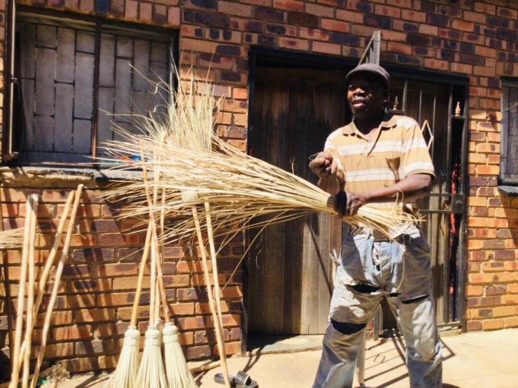 Entrepreneur father makes brooms to pay for his children's school fees